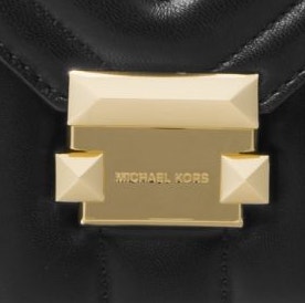 Image showing the enlarged Michael Kors emblem on the Whitney large quilted leather shoulder bag