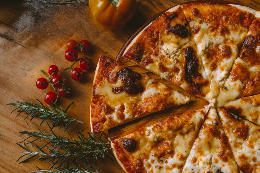 cheese pizza on table